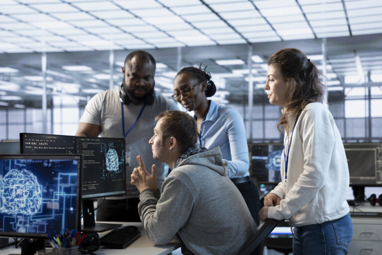 Manager doing team meeting with data center technicians, delegating tasks
