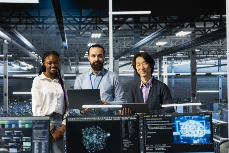 Portrait of smiling multiethnic engineers in data center troubleshoot using AI