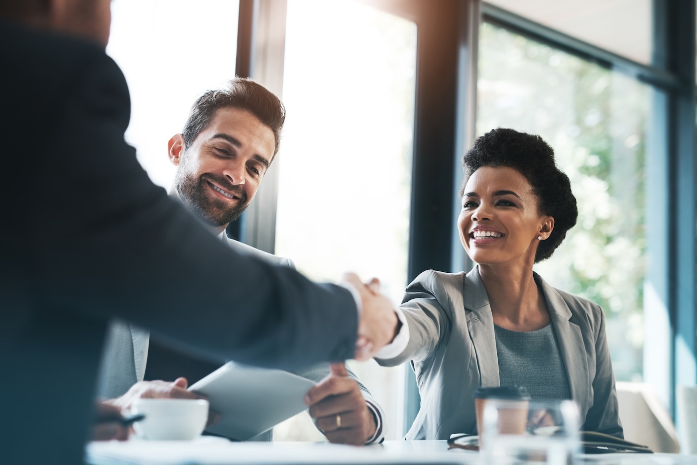 Business people, handshake and meeting for partnership, teamwork or collaboration in boardroom at office. Happy woman shaking hands in team recruiting, introduction or b2b agreement at the workplace. SSUCv3H4sIAAAAAAAAA21Sy26EMAz8l5z3AGyh2/2VqqpMYpaoSYwSsy2t9t/rJEh93mYcezxj+FAjJKvV+UNZ59bEEdhSUOfmoCIGg7HAazwOTUFoLFO04AobgfUcwKM6qzQT8fOpbZu7e3U7qMTAa8Ik2sI0MF5ksPCvpVKWUSXd65iBdDb/1m/Zj0Mogo9qGLrpvtF6QukZTw12CPjQC5n6vh9OMMjL00G9vDJGv3uA1ViqcIlW23CphHjOOYtNOQH57CDNK8usUP2SeQ0eiJG3RfK24m3S4iesfszjqj0O/V3XdMVsbkw1gpHoe5hyktmKaNzqwqJvze5wXRyB4WxSgaER9/V52Q8/UjARwSe2vpoBB34rCDdEX5CnxMtMTKnQDTZvdaRCFgqmL0iTozWO9FbrEPI5vOSFugcXSva7zmgvxUYpVQlnF4Pg8h2yhn1j2B3k30k+nMfAdVpD+DWd/pbeiQJUMWNTInetKdvuGCdBt9sn+M0BfLoCAAA=