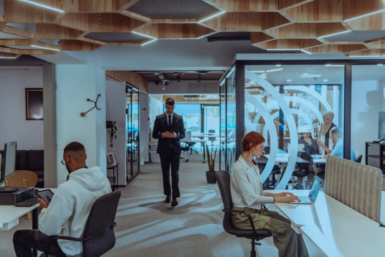 Young group of business people brainstorming together in a startup space, discussing business projects, investments, and solving challenges