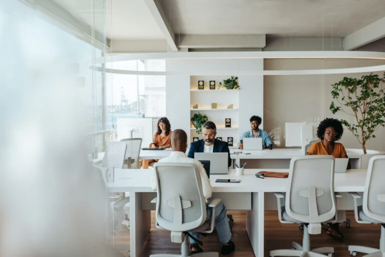 Multicultural colleagues working together in a creative coworking office