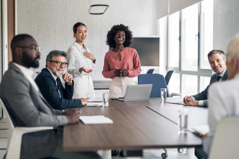 Diverse business team collaborating during office meeting presentation