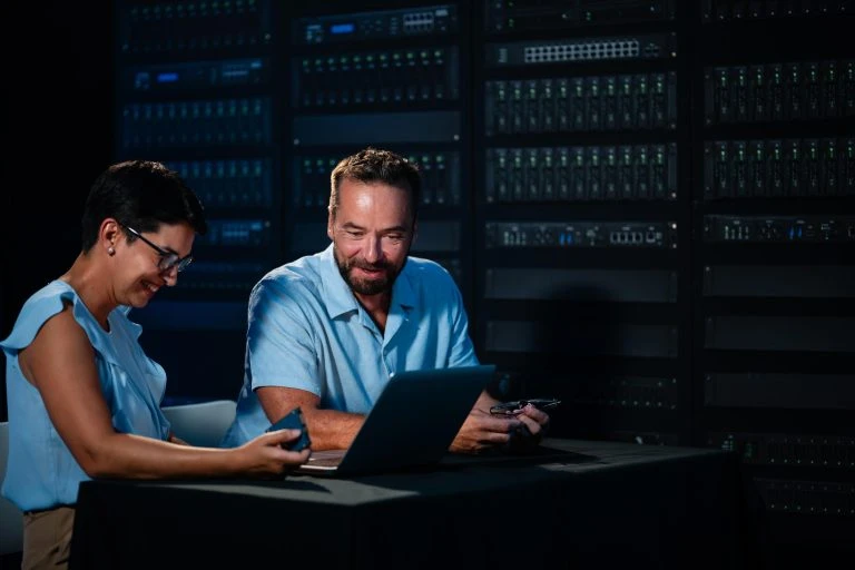 It technicians collaborating on server maintenance in data center
